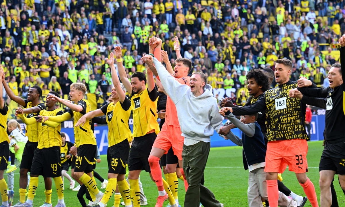 Borussia Dortmund players celebrate securing Champions League spot