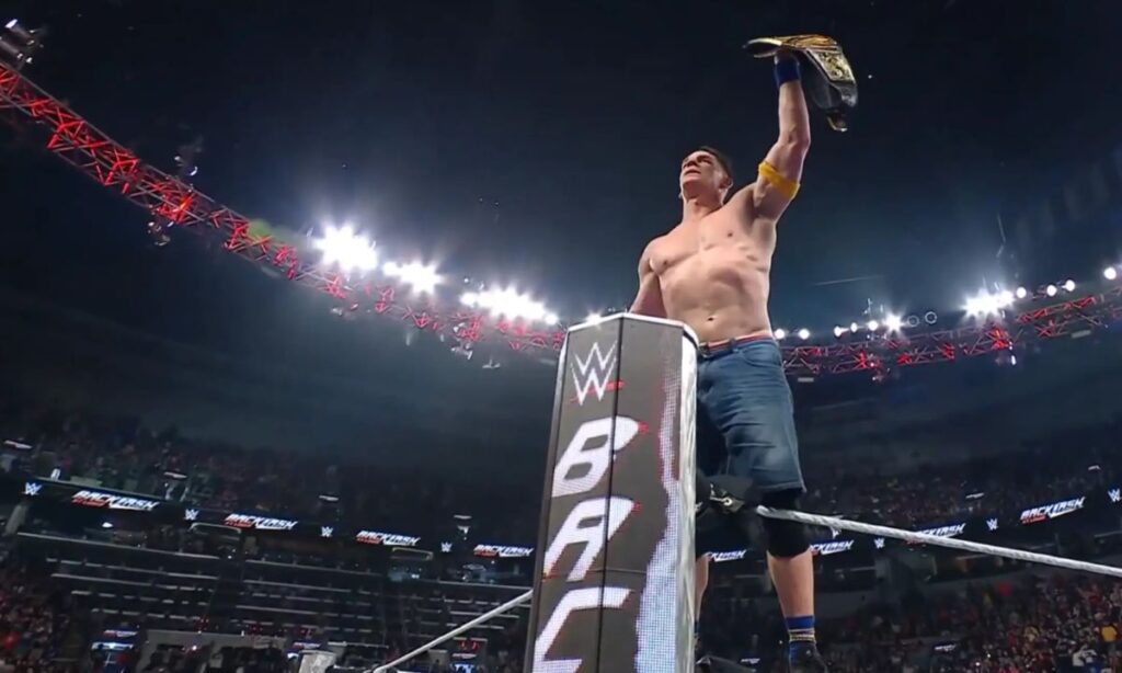 John Cena celebrates his win at WWE Backlash 2025.