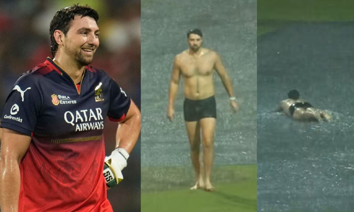 Tim David swimming on pitch cover in rain at Chinnaswamy Stadium
