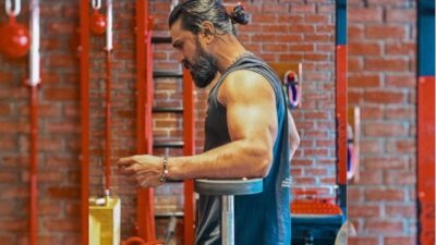 Ram Charan training at the gym in a sleeveless outfit, preparing for his role in Peddi.
