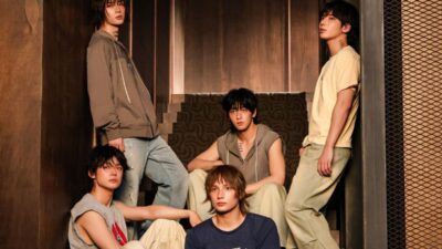 TXT performing in the cinematic music video for “Beautiful Strangers”